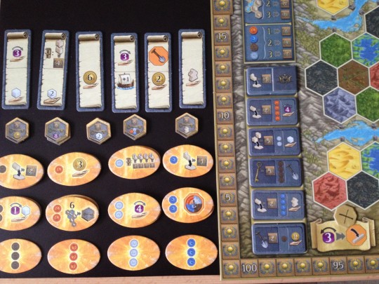 The board is set up, the tokens are in piles and the game is ready to begin!